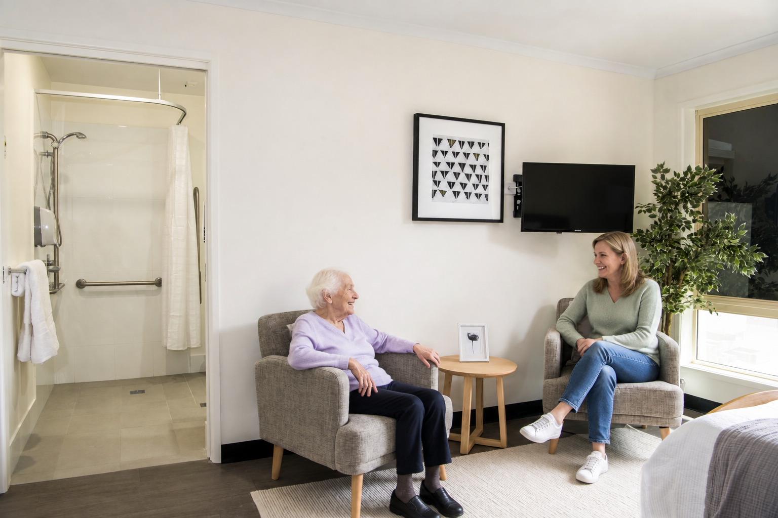A BallyCara staff member and resident in a collaborative discussion about personalised care.