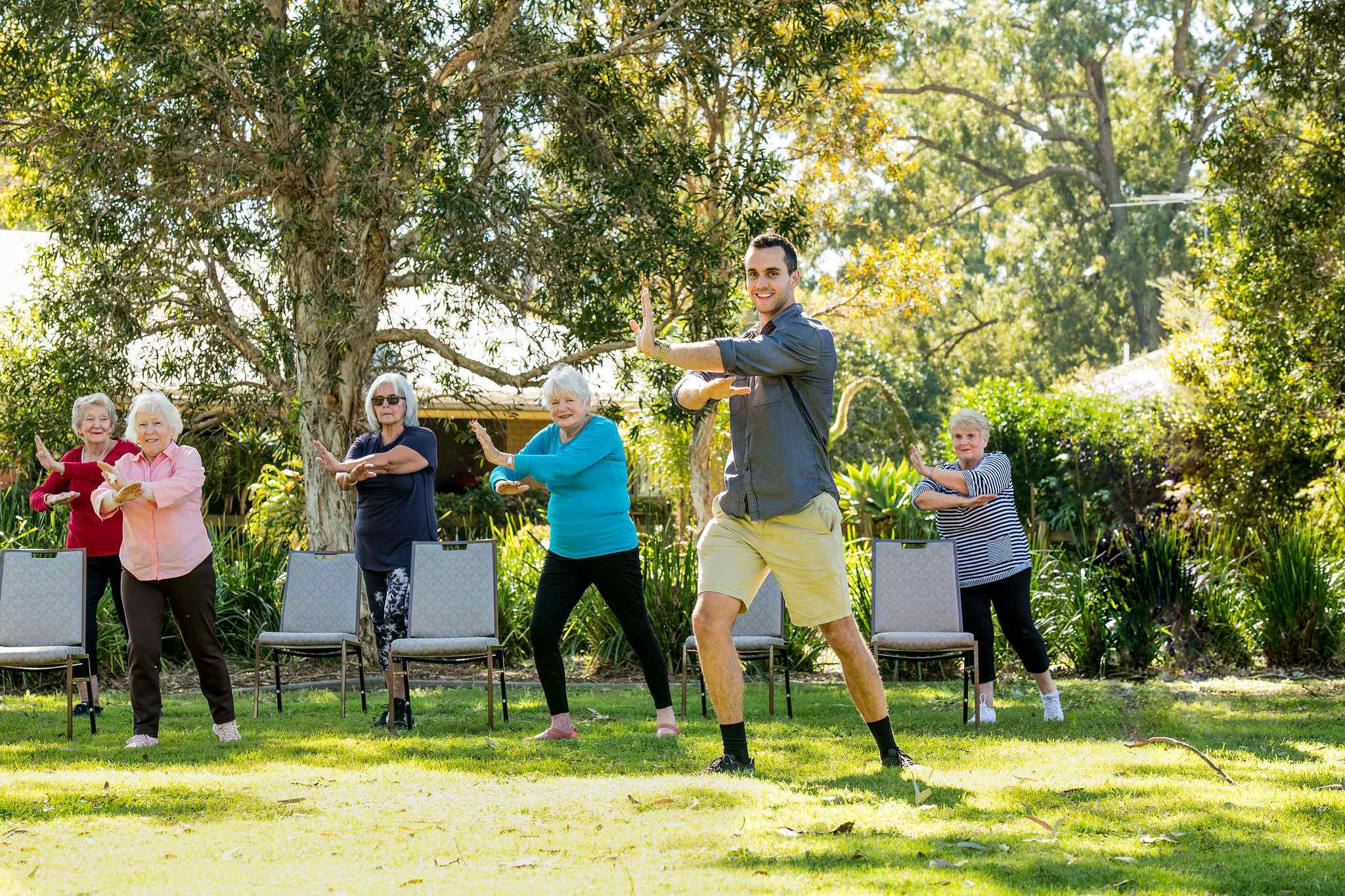 Residents participating in an outdoor Tai Chi class facilitated by BallyCara’s accredited Exercise Physiologists.