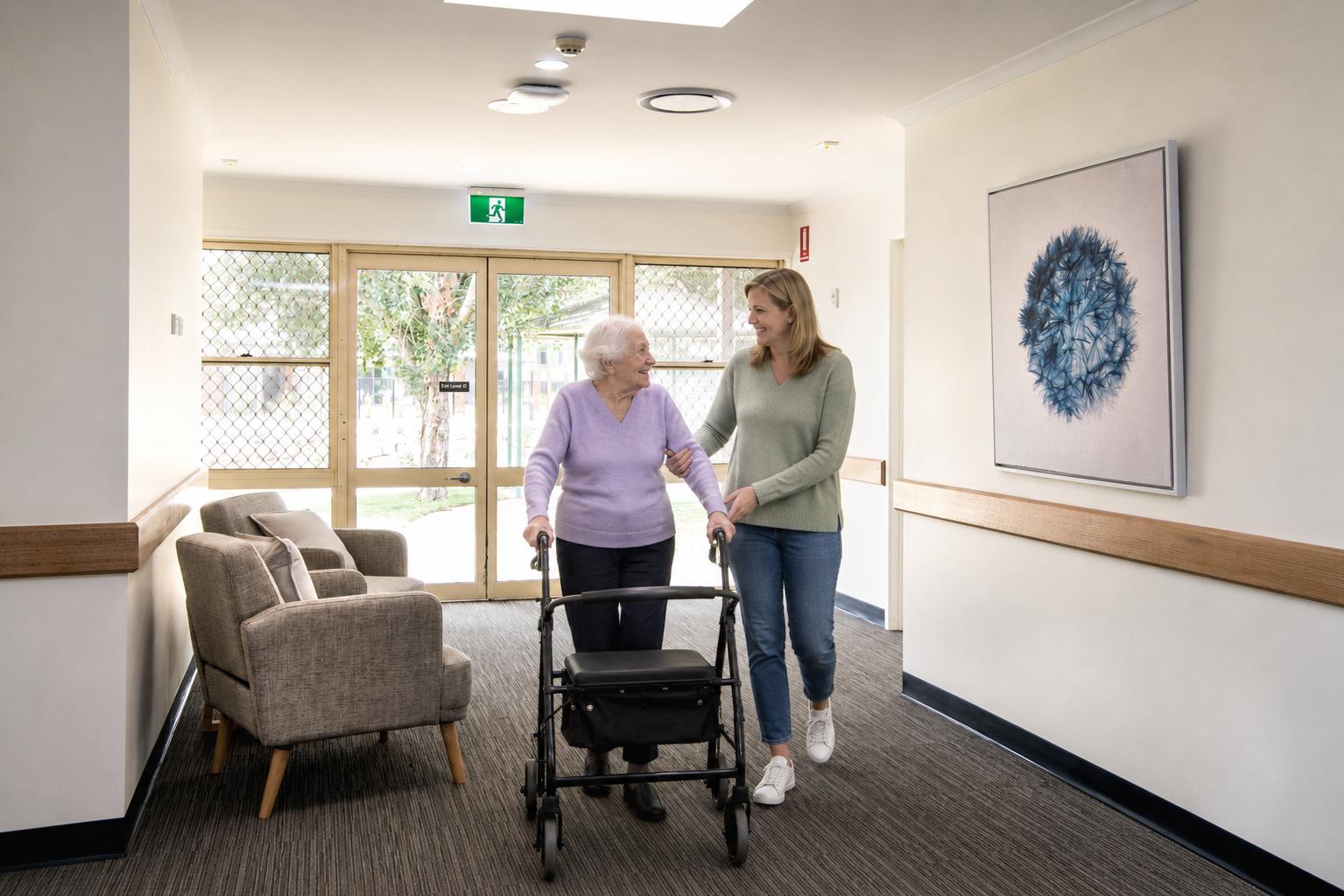 A BallyCara staff member and resident sharing a friendly conversation in a private room, highlighting our relationship-driven care.